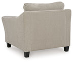 Taupe upholstered chair back and seat with wide arms and dark square legs