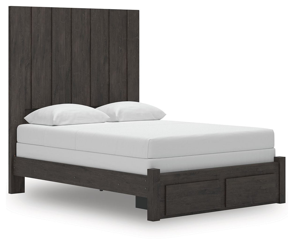 Dark gray panel storage bed with tall headboard, white mattress, and two pillows