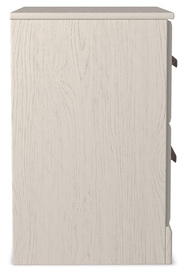 White two-drawer night stand side view with dark bar drawer handles