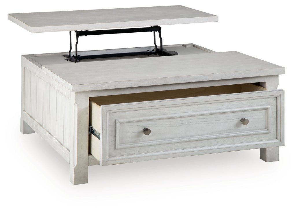 White lift-top table with a hidden compartment and front drawer with metal knobs.