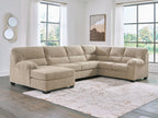 Light beige sectional sofa with corner chaise, tufted back, rounded arms, plush cushions