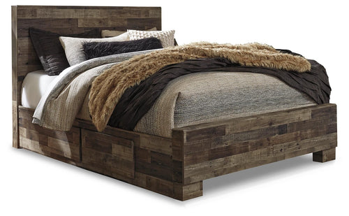 Dark wood panel bed with gray upholstered headboard and faux-fur throw over bedding
