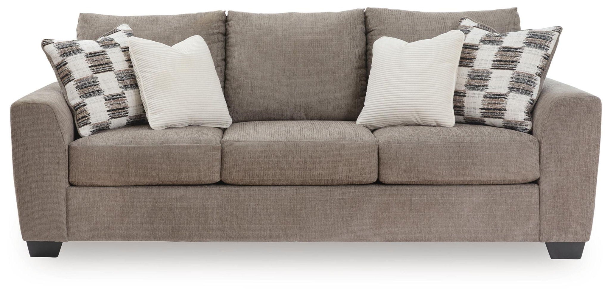 Sofa sleeper, beige upholstery with plaid and white throw pillows.