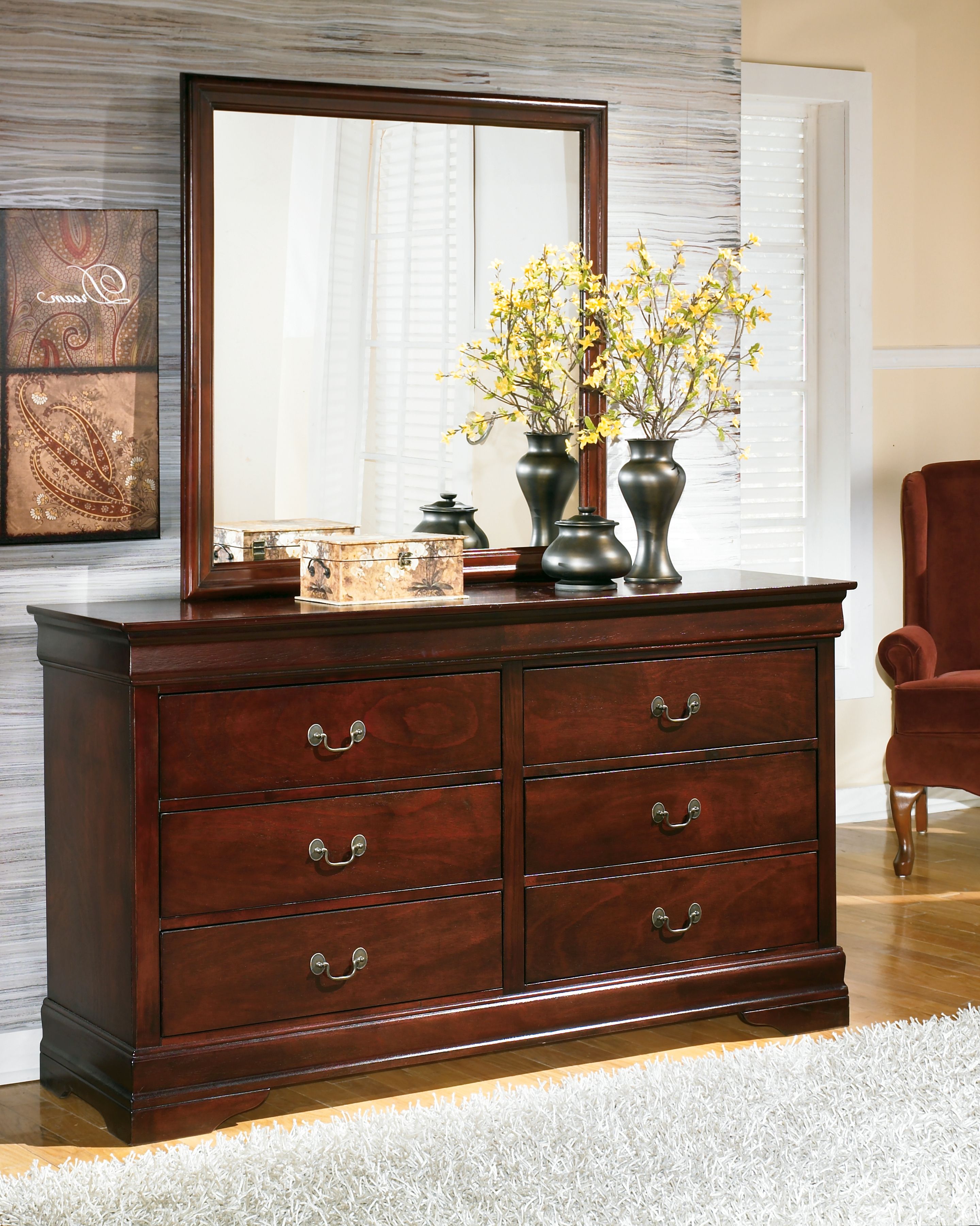 Dark brown wood dresser with four drawers and attached mirror