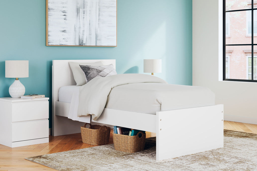 White panel platform bed with headboard and side storage drawer fronts.
