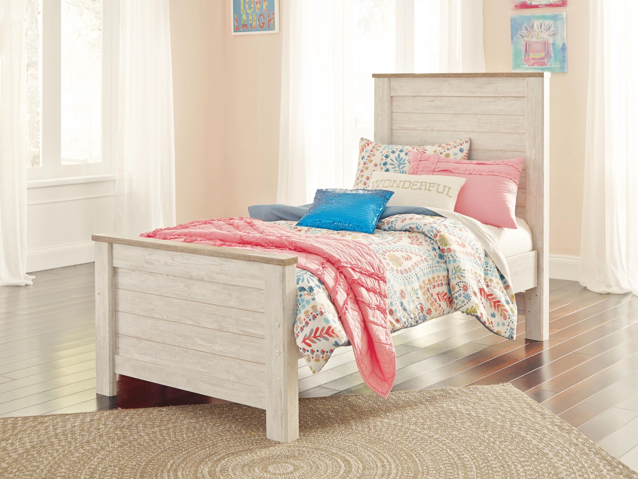 Beige panel bed with slatted headboard and footboard, styled with bedding