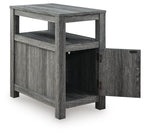 Chair side end table in weathered gray wood with open shelf and open cabinet door