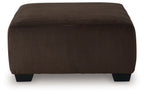 Oversized accent ottoman in chocolate-brown ribbed upholstery with short dark feet