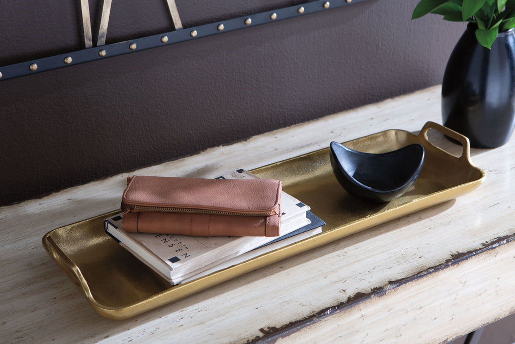 Gold-finish rectangular tray with raised edges and side handle cutouts