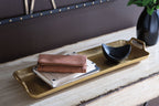 Gold-finish rectangular tray with raised edges and side handle cutouts