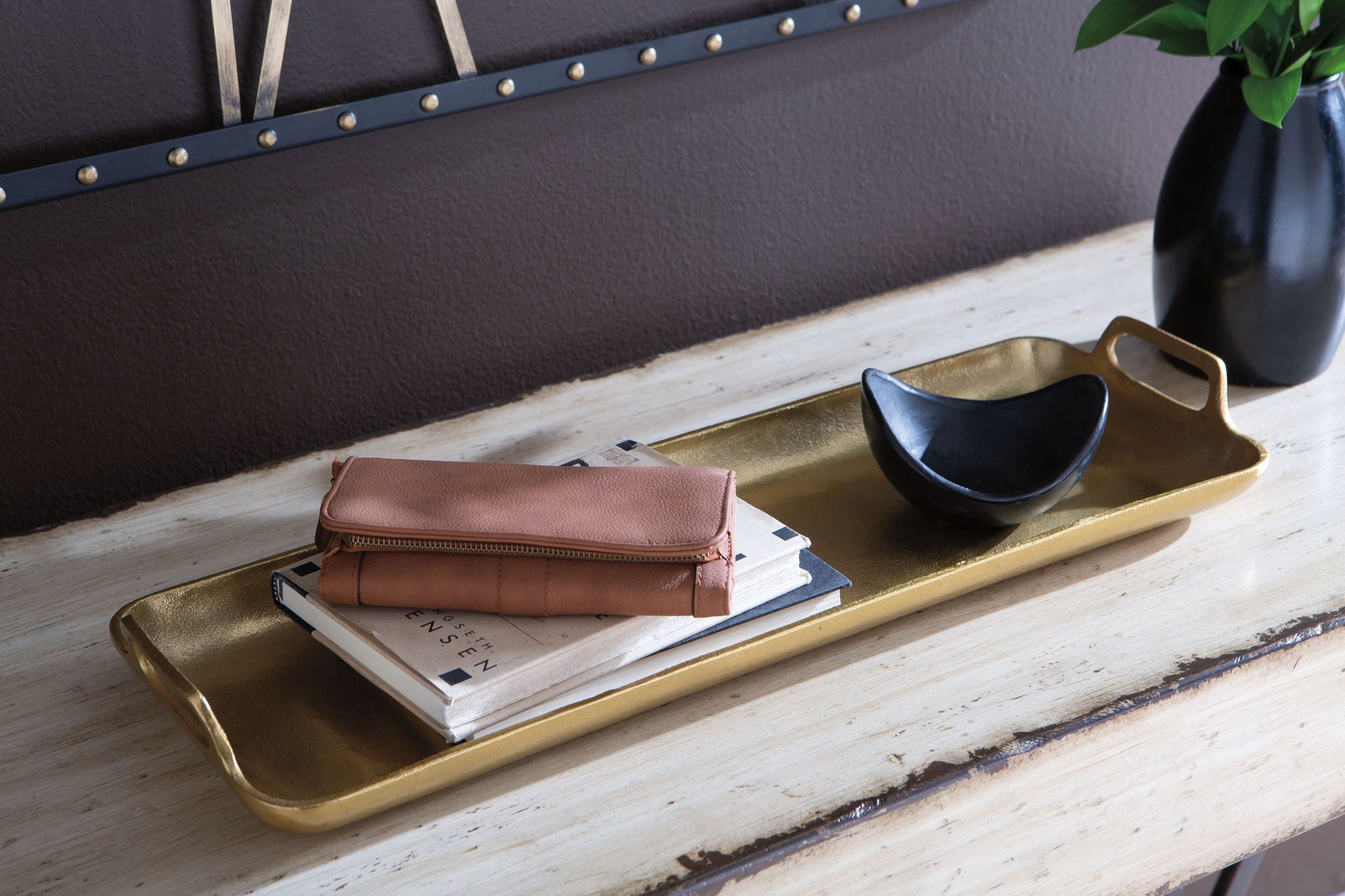 Gold-finish rectangular tray with raised edges and side handle cutouts