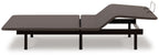 Adjustable bed base with split platform and raised head section, side angle view