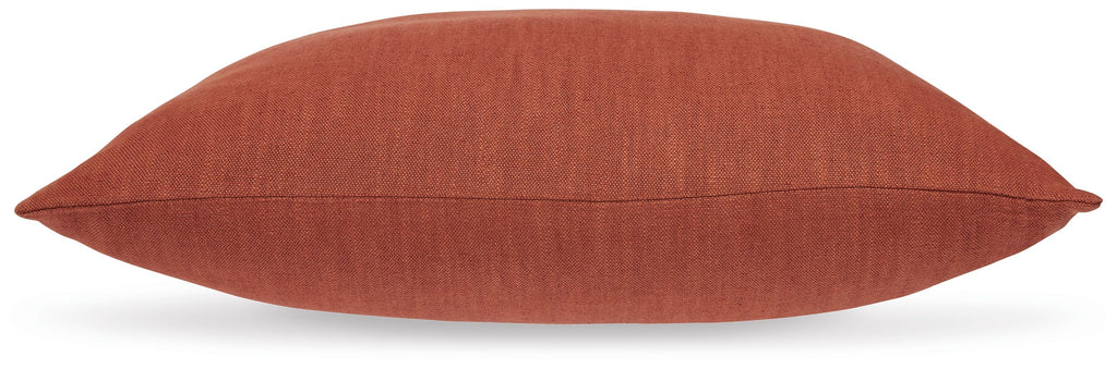 Burnt orange square throw pillow with stitched seam along the edge