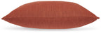 Burnt orange square throw pillow with stitched seam along the edge
