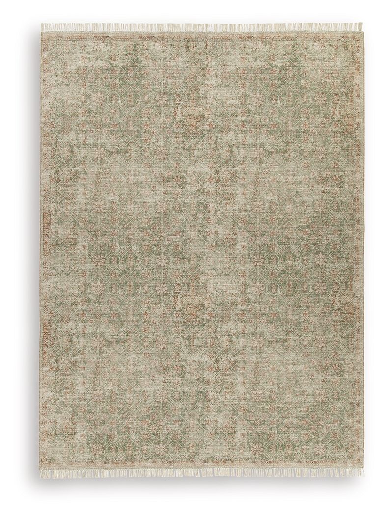 Rossbury rug with light beige base and green flecked pattern, fringed border