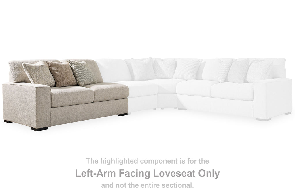 Sand-tone upholstered left-arm loveseat with three back pillows and two-seat cushions