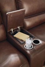 Reclining sectional armrest console with cup holders and charging panel
