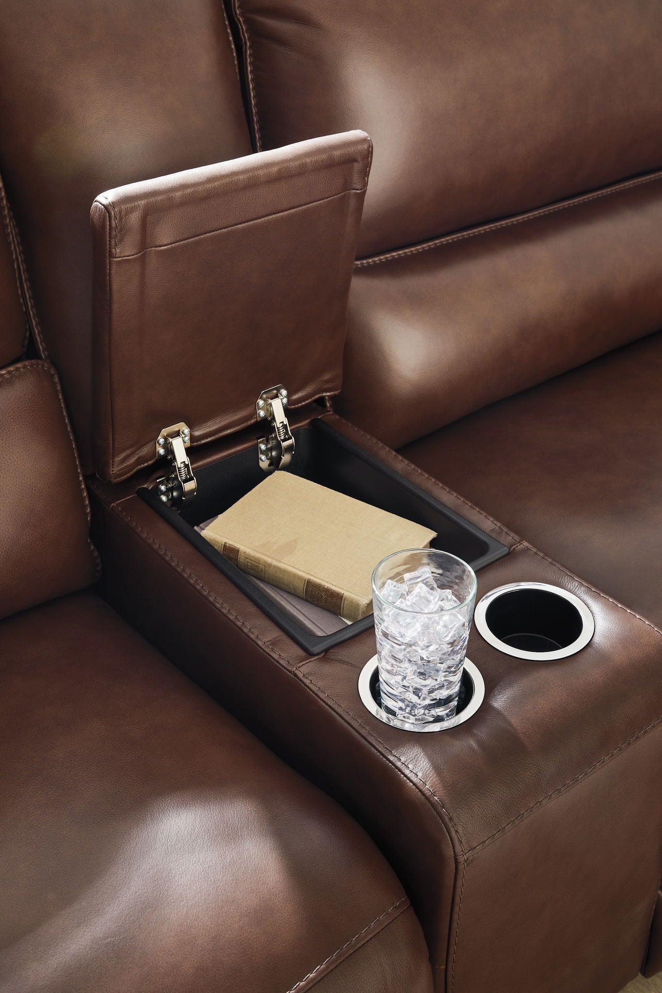 Reclining sectional armrest console with cup holders and charging panel