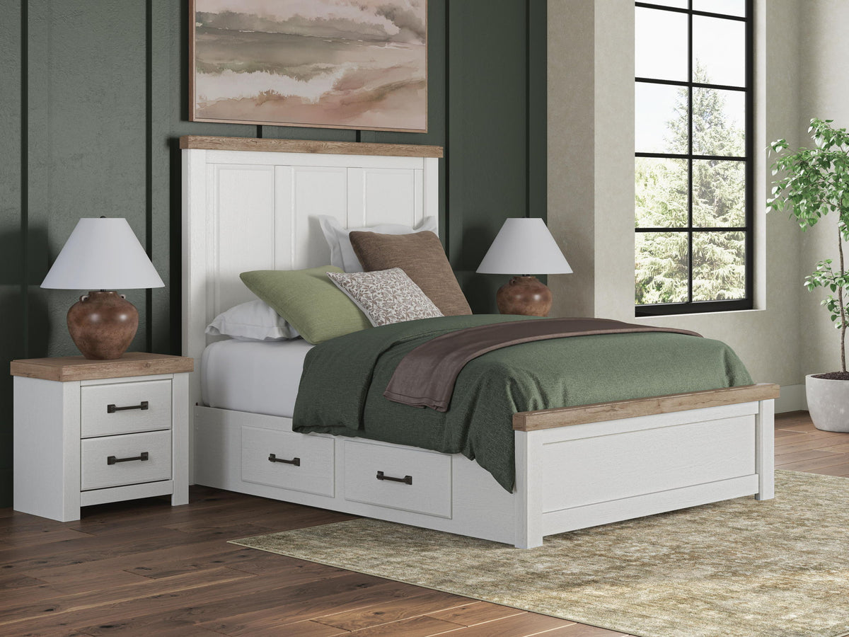 White panel storage bed with built-in drawers at the footboard