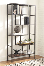 Dark brown bookcase with open cubbies and multiple square shelves