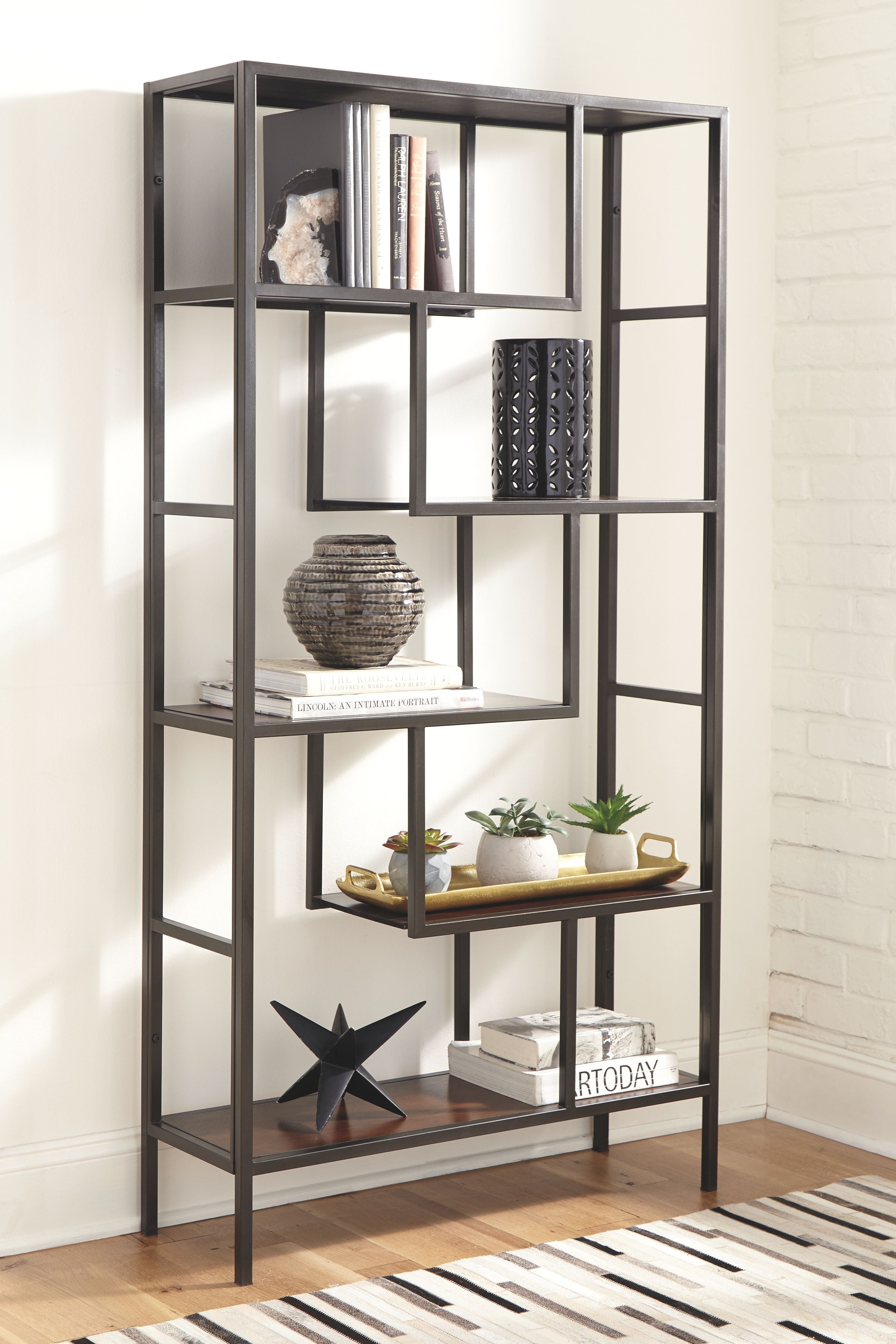 Dark brown bookcase with open cubbies and multiple square shelves