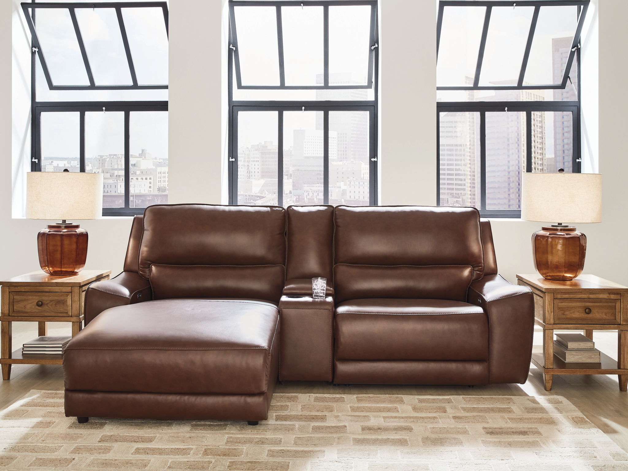 Power reclining sectional in dark brown faux leather with chaise extended forward