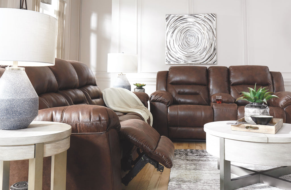 Dark brown reclining sofa and loveseat with tufted backs and open footrests
