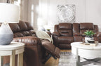 Dark brown reclining sofa and loveseat with tufted backs and open footrests