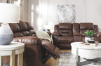 Dark brown reclining sofa with matching recliner chairs and cushioned armrests