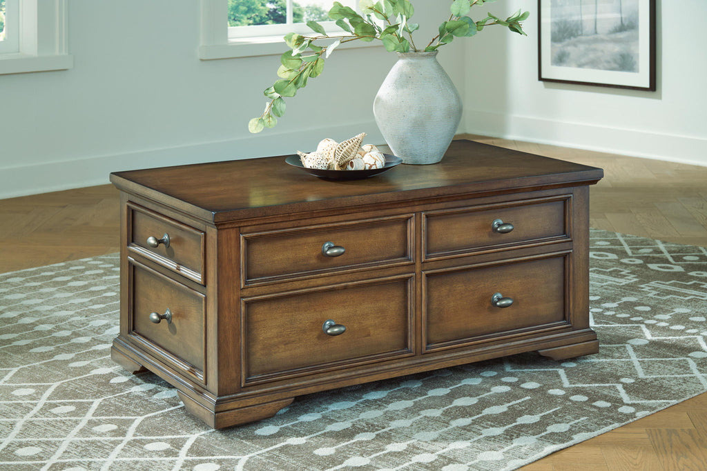 Dark brown wood table with four drawers and metal drawer pulls