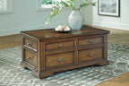 Dark brown wood table with four drawers and metal drawer pulls