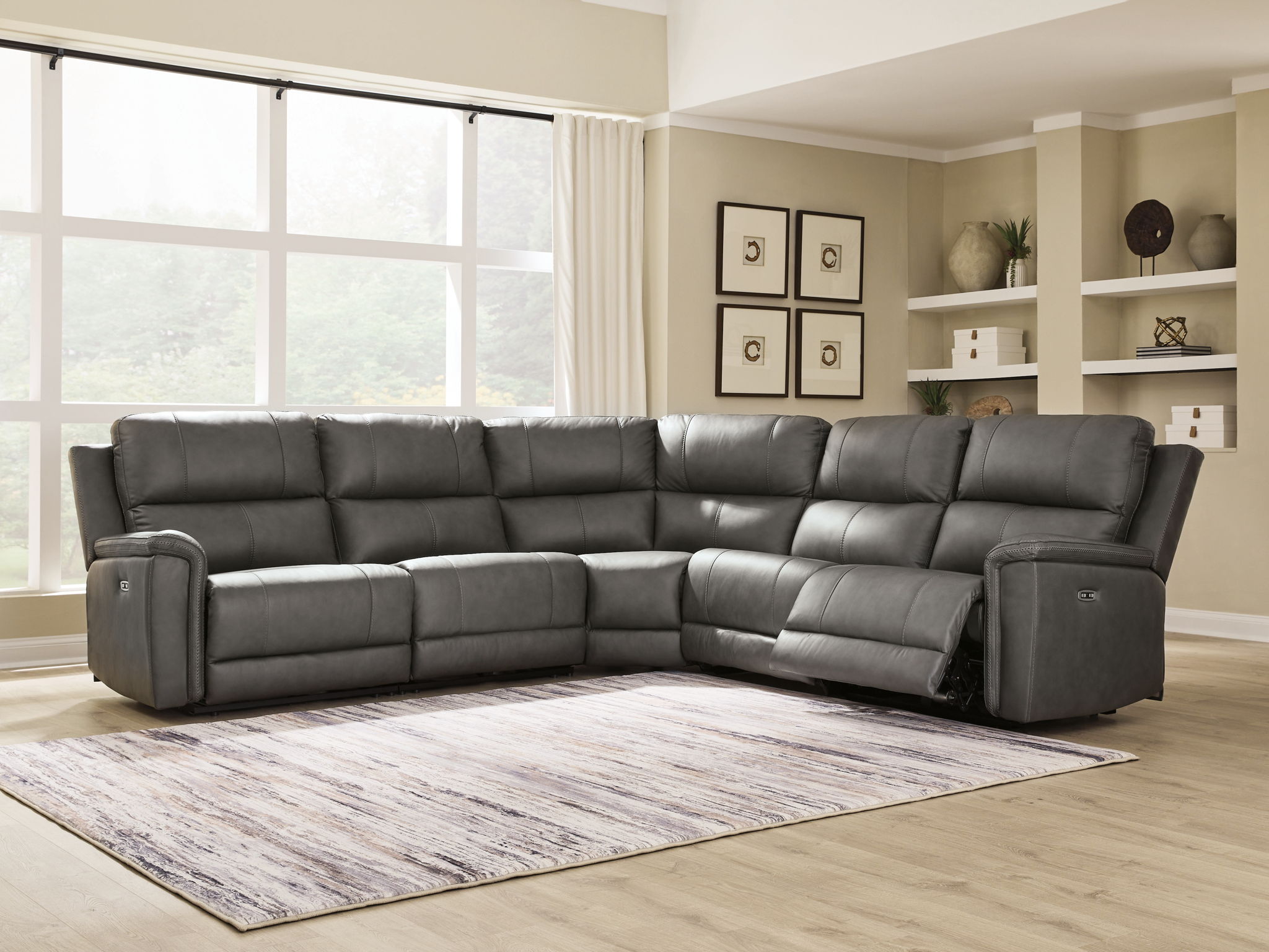 Power reclining sectional sofa, dark gray with padded arms, recline chaise, and corner section