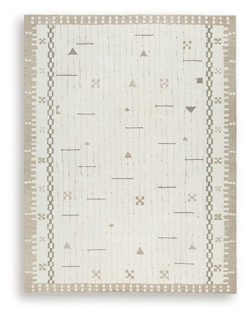 Light brown area rug with white geometric line and dot patterns