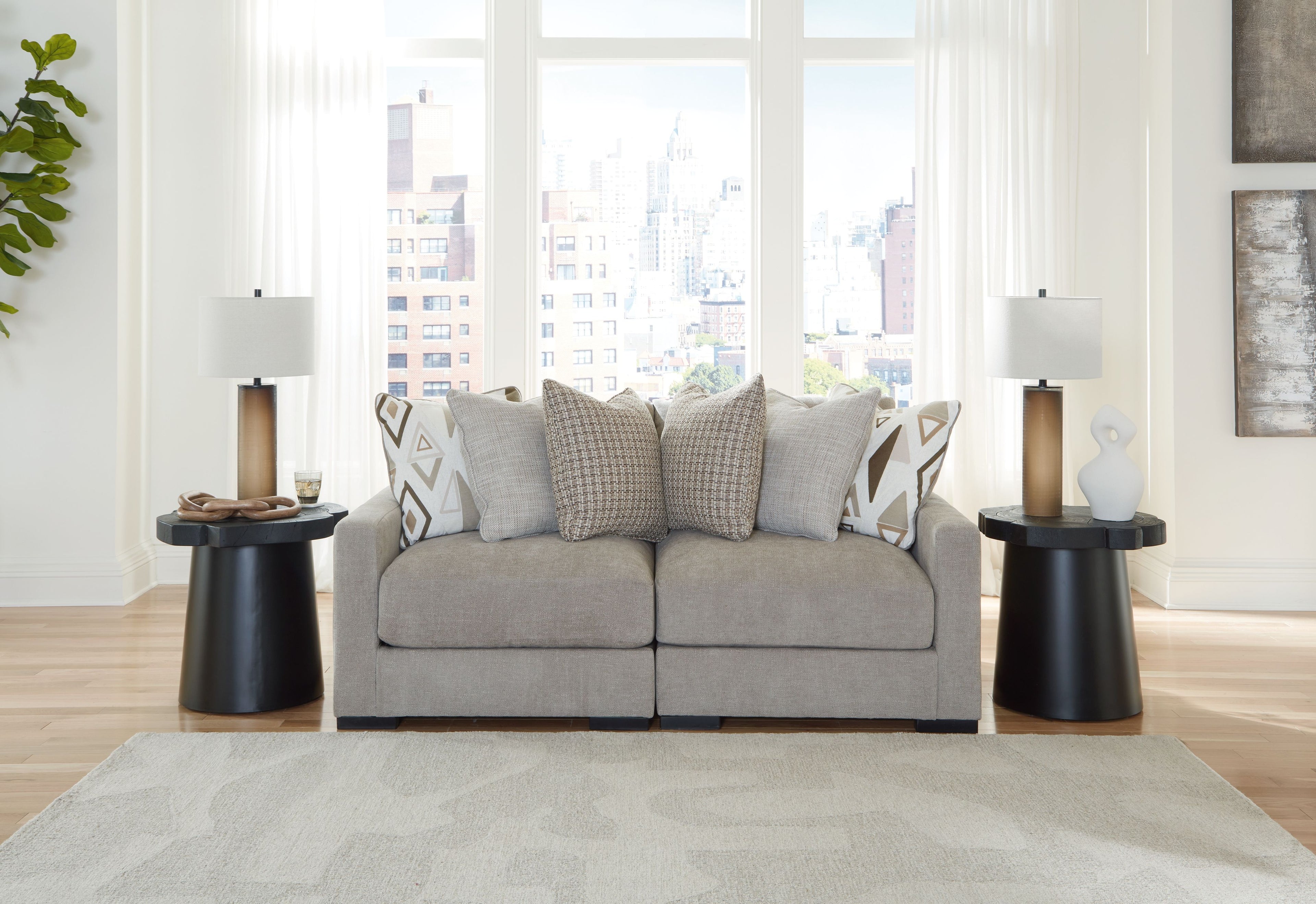 Pebble gray sectional sofa with chaise and geometric accent pillows