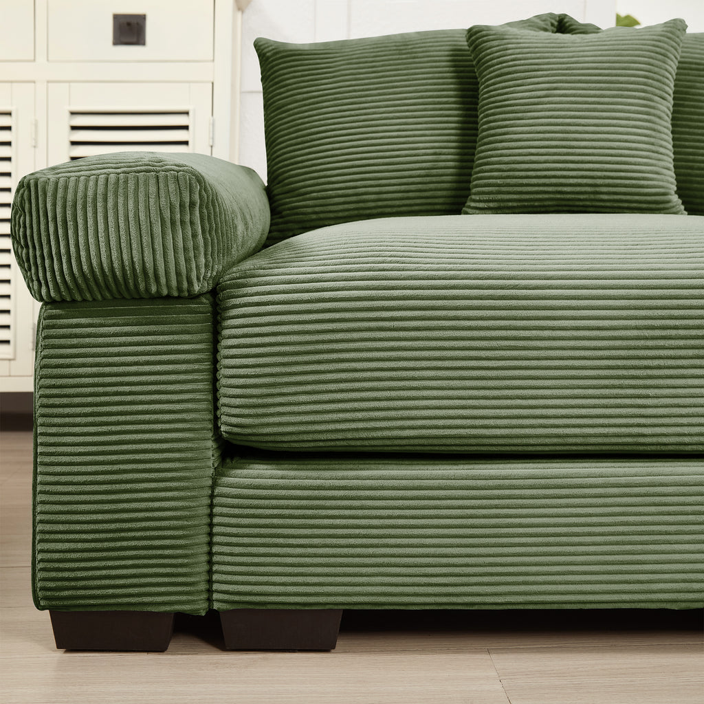 Green corduroy sectional sofa with ottoman and three cushions