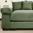 Green corduroy sectional sofa with ottoman and three cushions