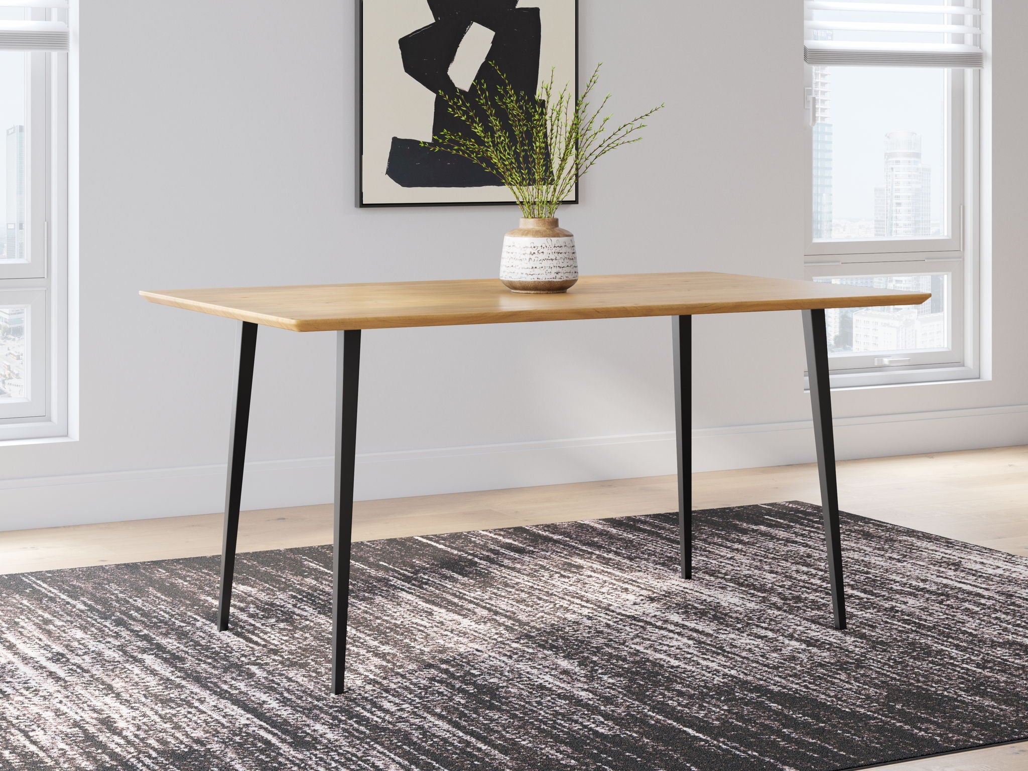 Light brown dining table with black legs and rectangular tabletop