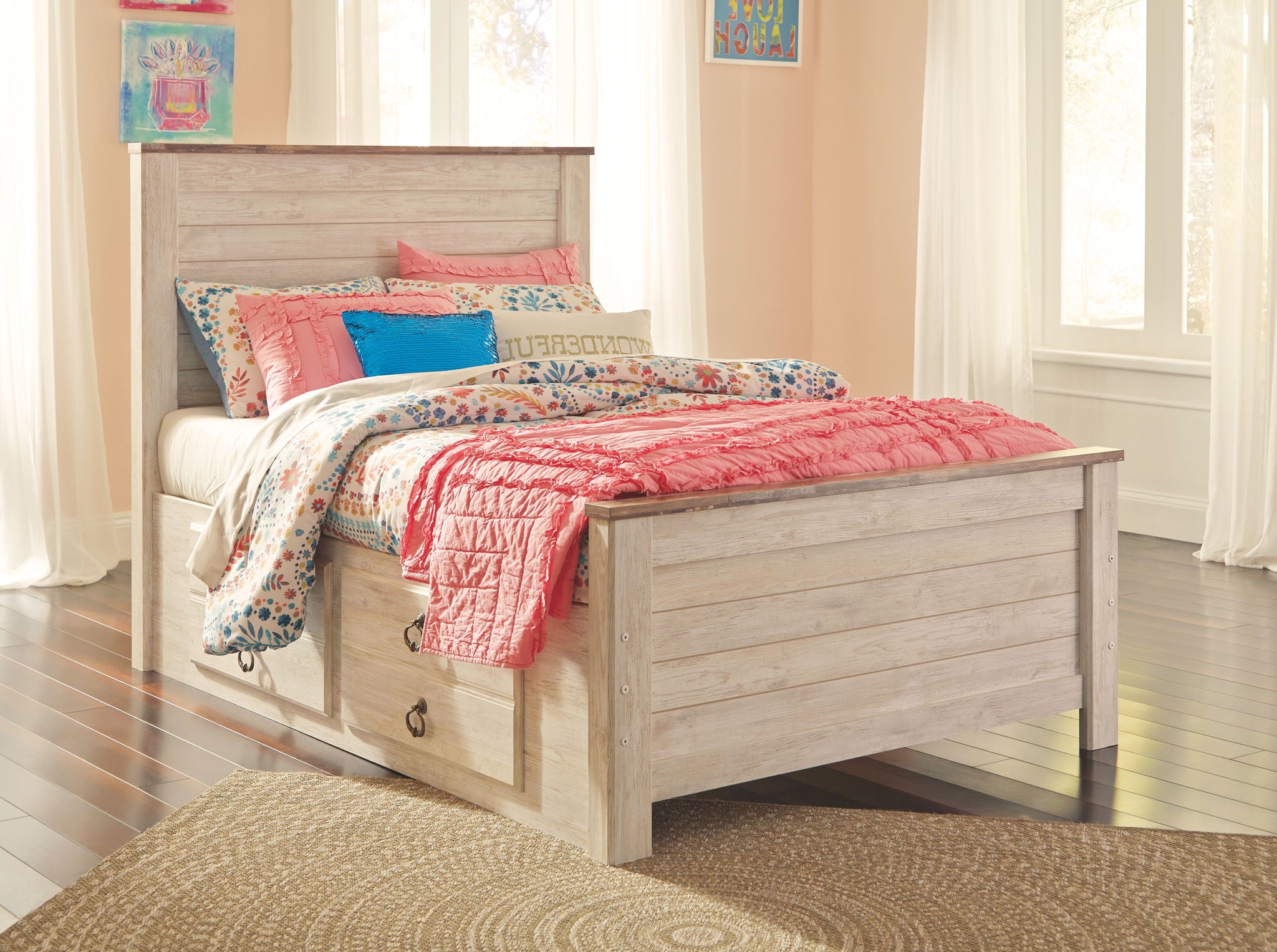 Beige panel bed with two drawers and slatted headboard, styled with red and floral bedding