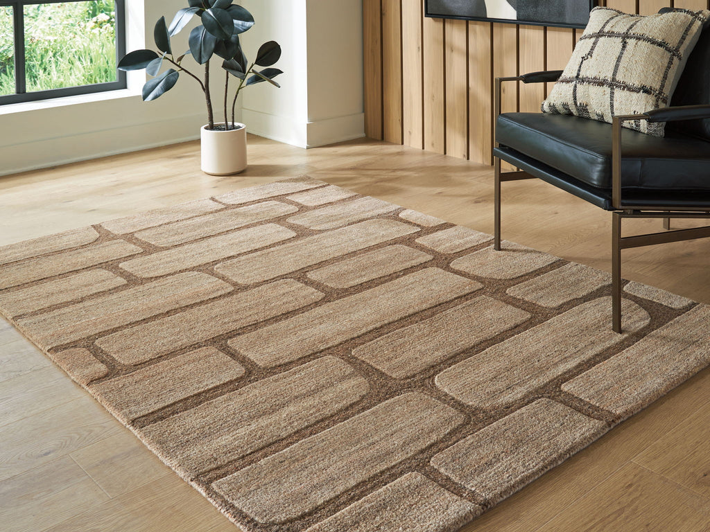 Large brown and beige brick-pattern area rug with low, textured pile