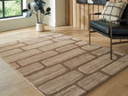 Large brown and beige brick-pattern area rug with low, textured pile