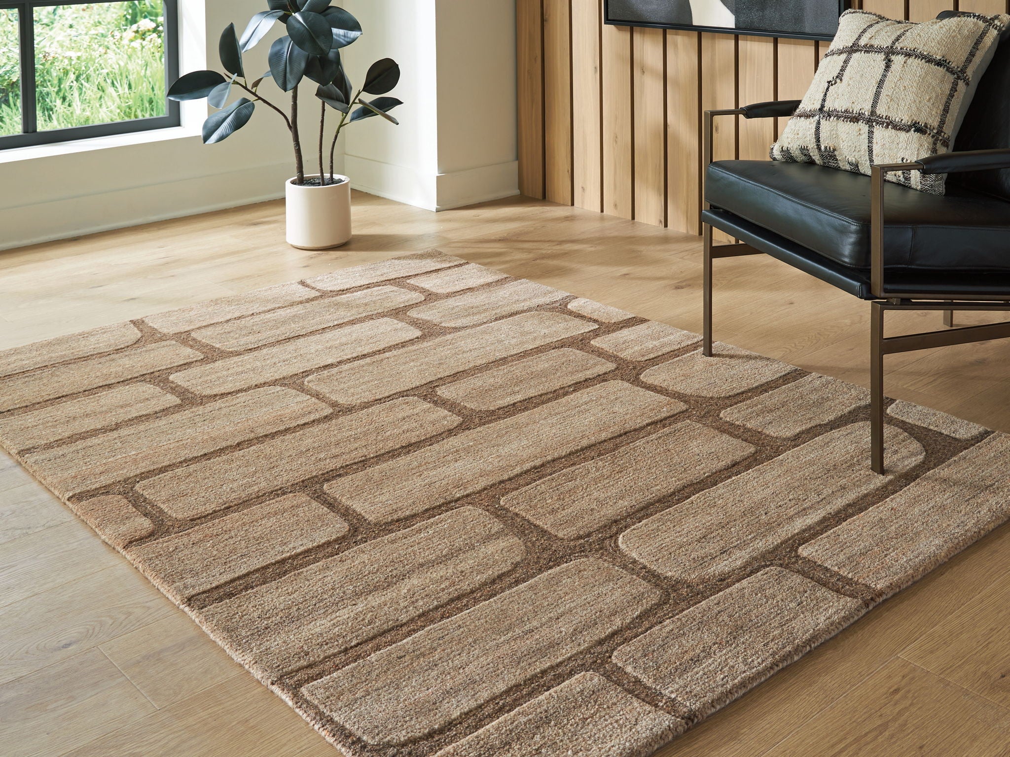 Large brown and beige brick-pattern area rug with low, textured pile