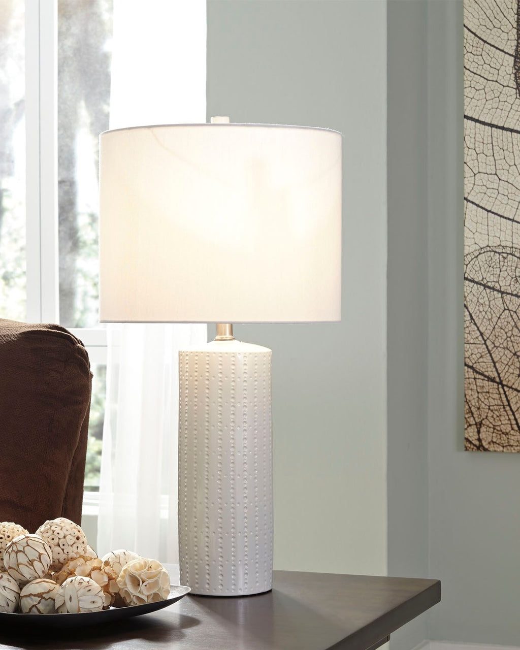 Steuben ceramic table lamp with white drum shade and textured white ceramic base