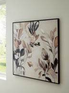 Framed abstract botanical wall art with tan, brown, and black flowers and leaves.