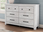 Whitewash six-drawer dresser with black bar pulls and a smooth top panel