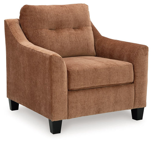 Clay upholstered armchair with wide arms, cushioned back, and dark block feet