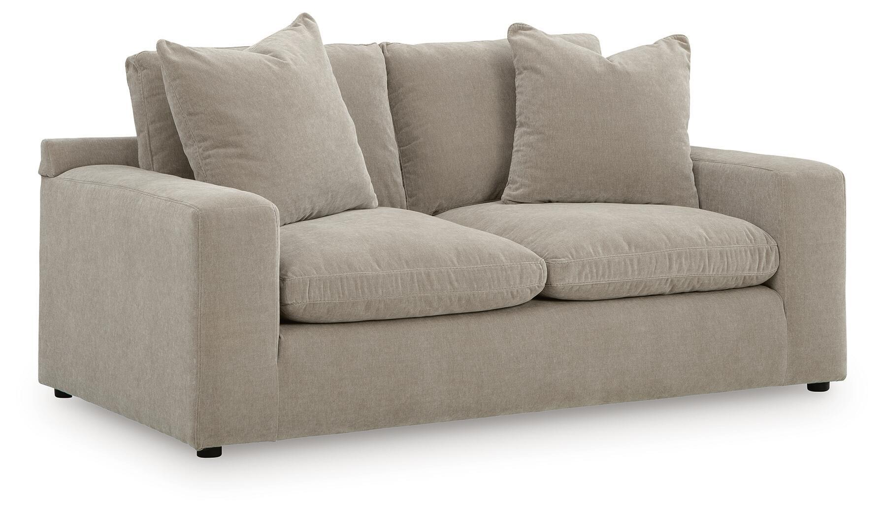 Gray loveseat with two seat cushions and four square back pillows, low arms