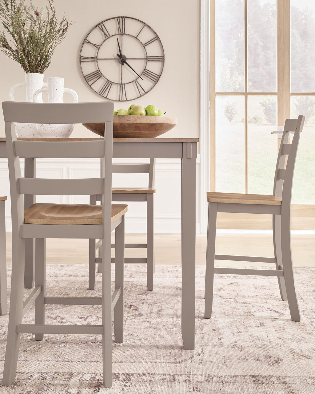 Dining chair and part of dining table with light wood seat and gray frame