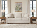 Light beige sofa with four back pillows and three seat cushions, front view