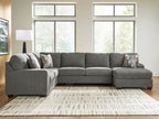 Gray sectional sofa with chaise, back cushions, and patterned accent throw pillows