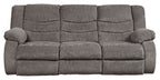 Gray reclining sofa with padded back cushions and rolled arms